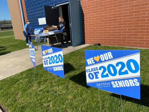 "We love our Seniors" signs are displayed outside of Belmont High School.