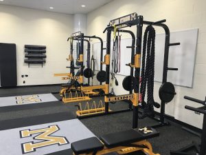 Exercise equipment lines the walls in a new exercise science classroom at Meadowdale.