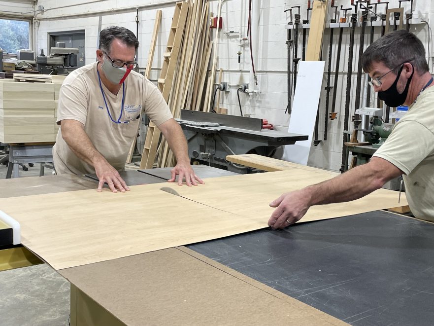 Gary Hites and Rodney Frisby build cabinets for Fairview elementary.